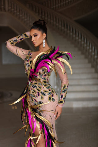 Stunning black, gold, and pink feather dress with shimmering stone embellishments.
