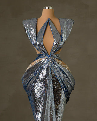 Glamorous light blue sequin dress with asymmetrical neckline and silver embellishments 