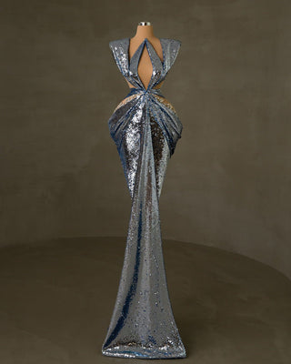 Elegant light blue sequin dress featuring cutouts, asymmetrical design, and silver details