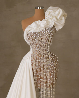 Bridal dress adorned with pearls and lace
