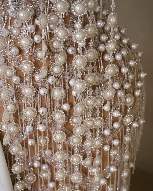 Bridal beauty in intricate lace and pearls