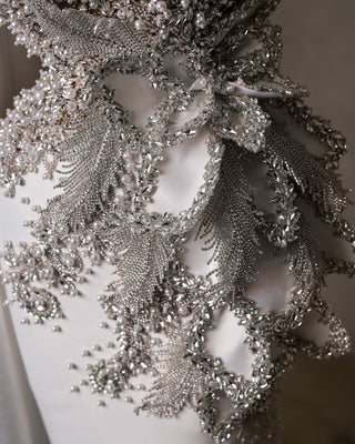 Detailed View of Bridal Dress Fabric Texture and Embellishments