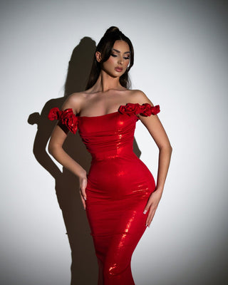 Striking red dress adorned with 3D floral embellishments