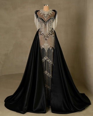 View of Black Dress's luxurious black satin cape, enhancing its regal appeal against the deep black lace