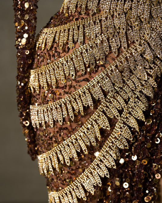 Close-Up of Gold Embellishments on Brown Sequin Dress