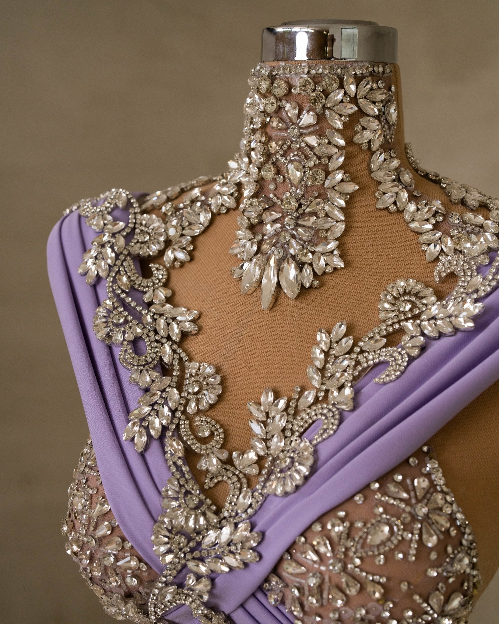 Close-Up of Gemstone Embellishments on Purple Dress