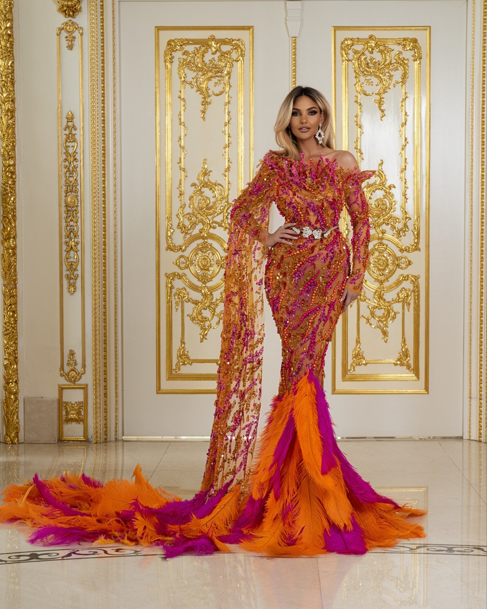 Glamorous Dress Adorned with Pearls, Feathers, and Side Cape for Special Occasions