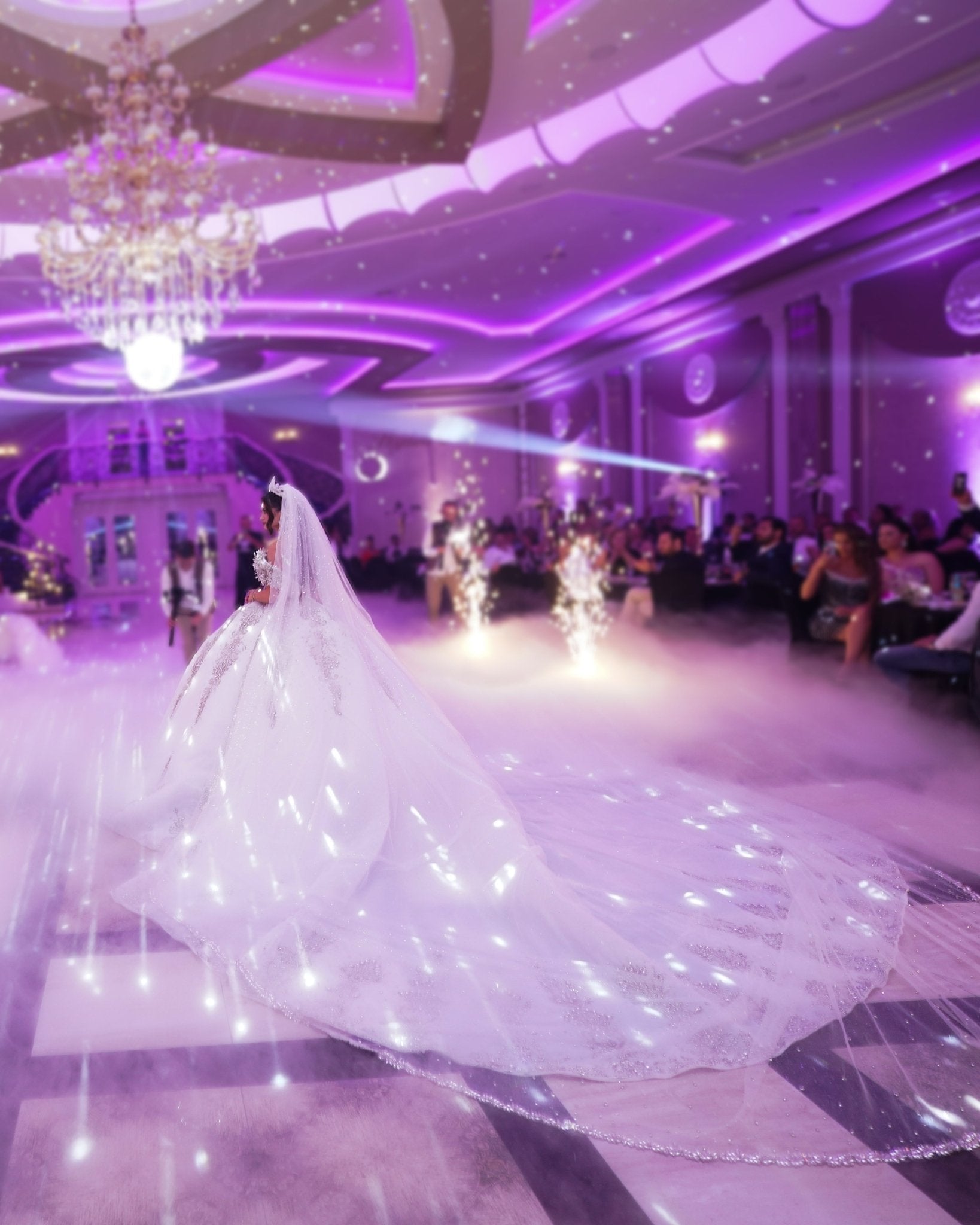 Luxurious white bridal gown with crystal lace