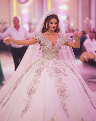 V-neckline lace bridal dress with crystals