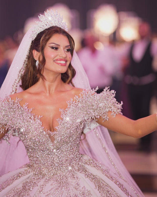 Regal off-shoulder bridal dress with crystals.