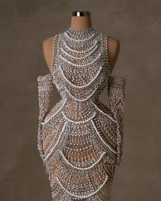 Modern bridal dress with daring shoulder cutouts.