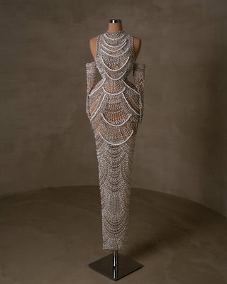 Pearl-studded bridal dress with cutout shoulders.