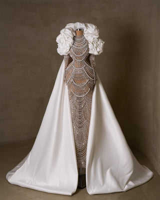 Luxurious bridal gown with intricate lace detailing.