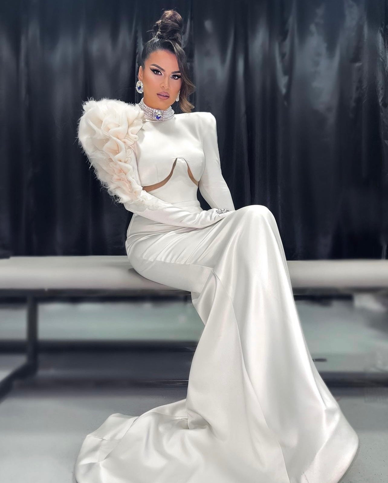 Ryva Kajtazi showcasing a stunning Blini's dress for a remarkable fashion moment