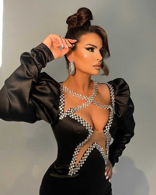 Ryva Kajtazi wearing elegant black dress by Blini