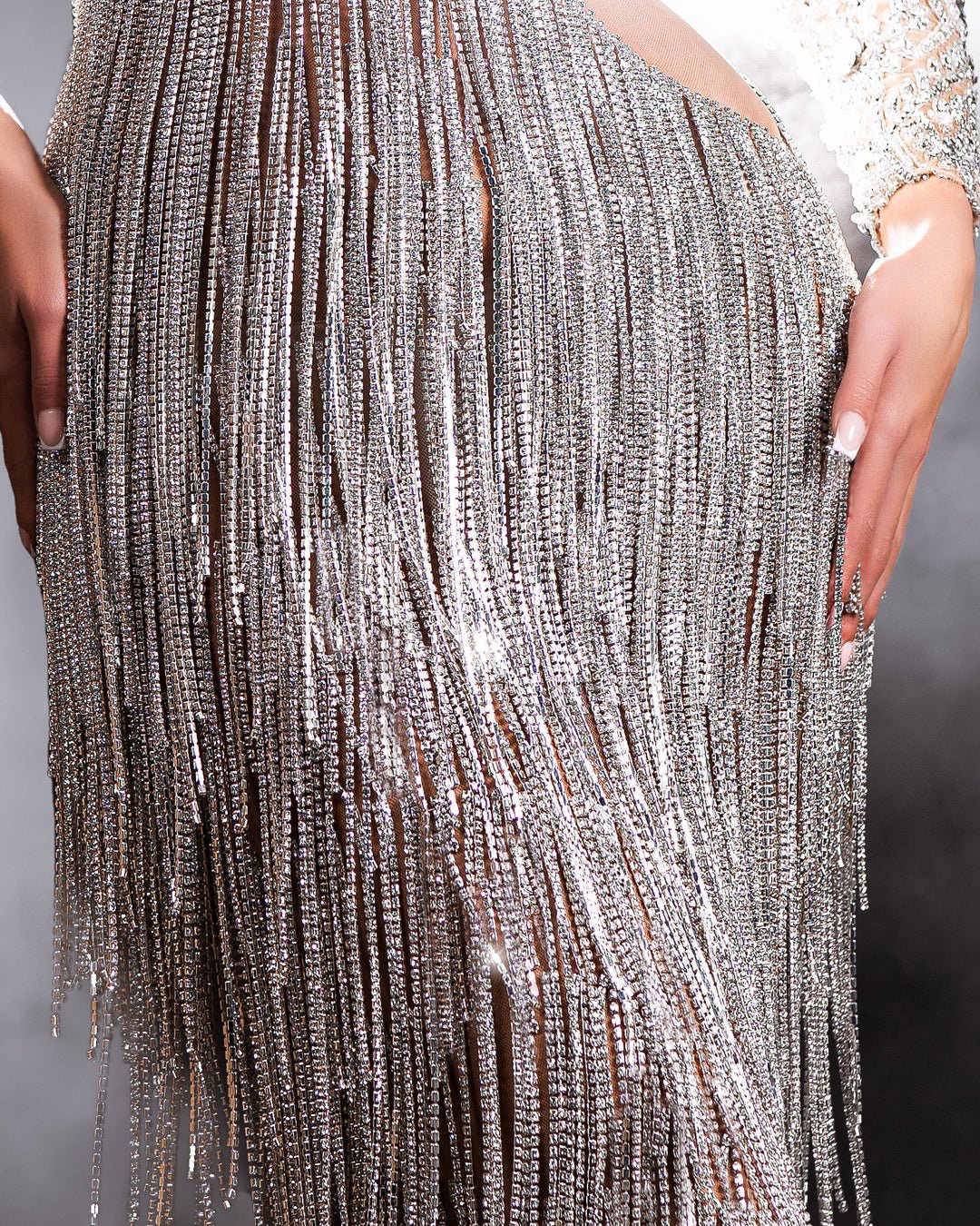 Close-Up of Silver Dress Bodice with Stone and Flower Embellishments
