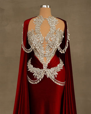 A luxurious red velvet dress, draped elegantly.