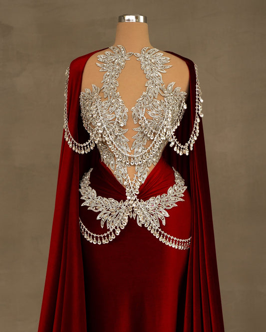 A luxurious red velvet dress, draped elegantly.