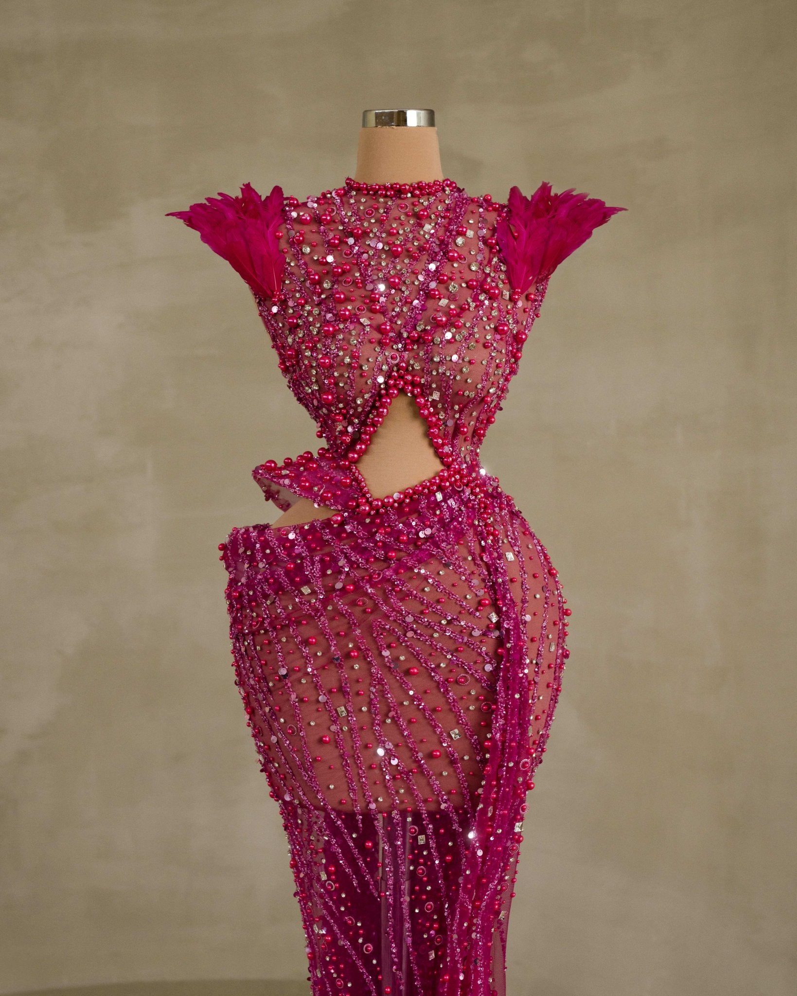 Fashionable Dress with Stunning Beadwork and Feather Details