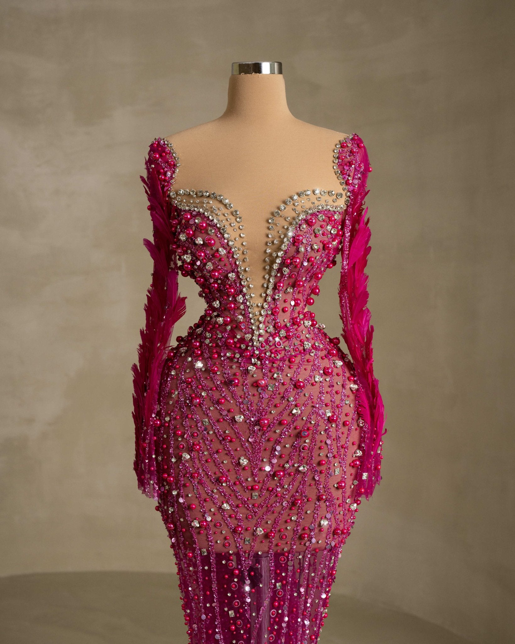 Stylish Dress Adorned with Intricate Stone and Feather Details