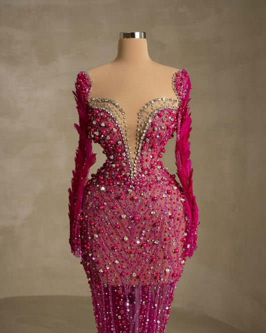 Stylish Dress Adorned with Intricate Stone and Feather Details