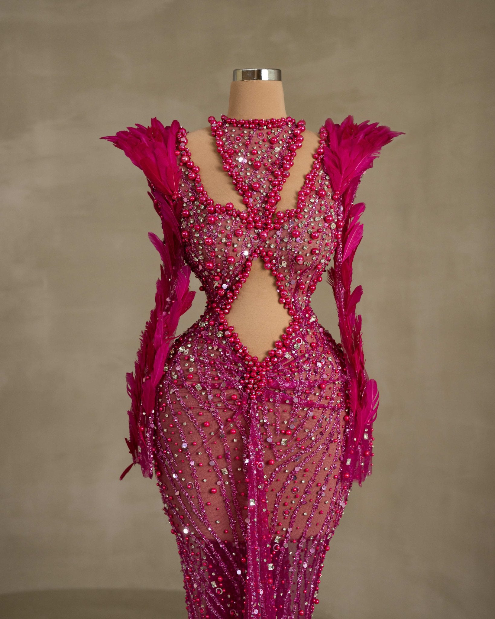 Fashionable Cutout Dress with Beaded Details and Feather Accents