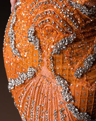 ntricate Lacework on Sleeveless Dress – Orange Elegance with Silver Crystal Embellishments