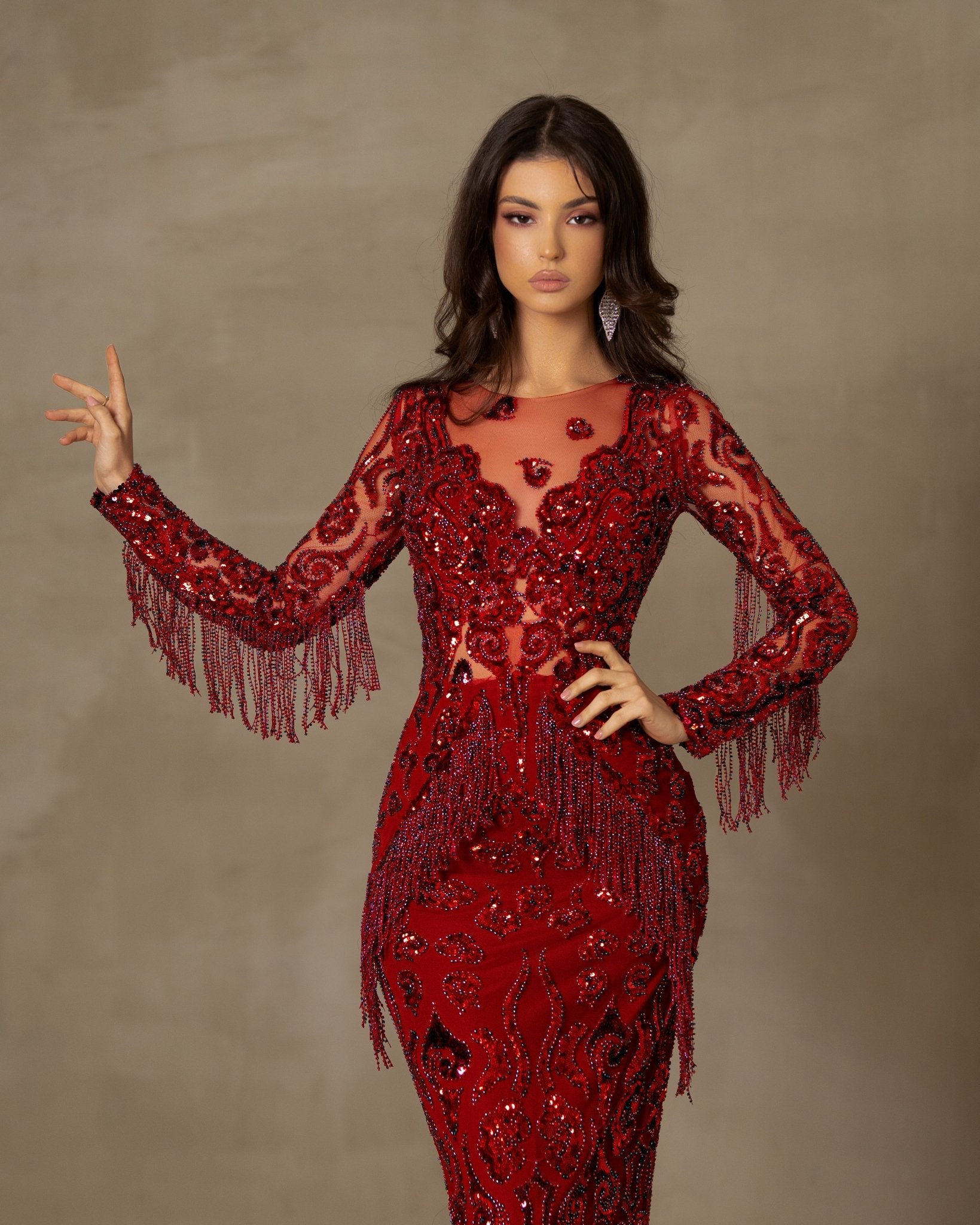 Red dress with playful tassels.