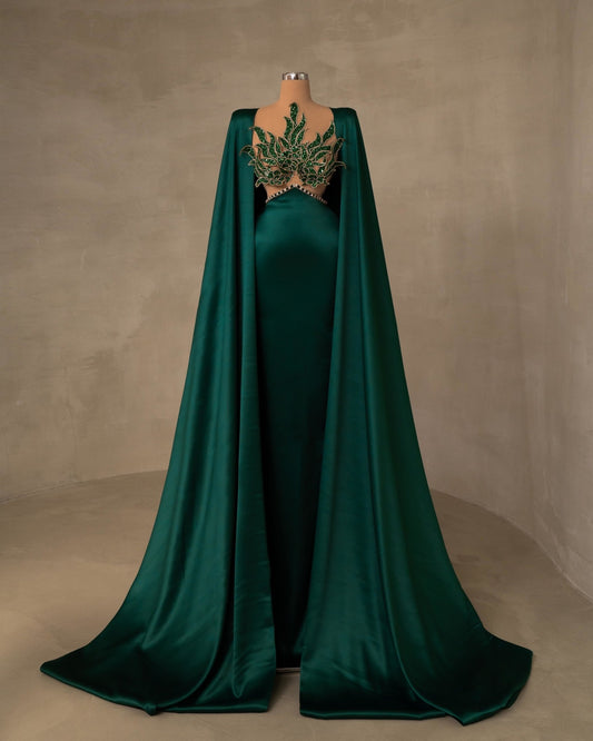 Elegant Green Evening Gown Featuring a Cape
