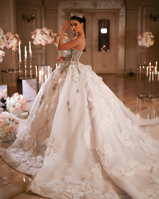 Bridal Dress with Long Tail and Intricate Embellishments