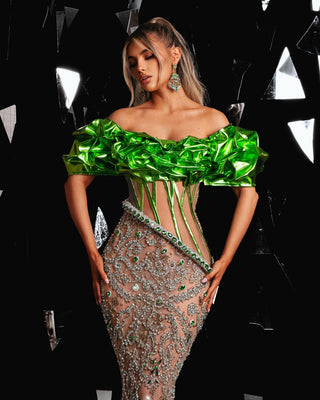 Long green dress featuring metallic leather 3D designs