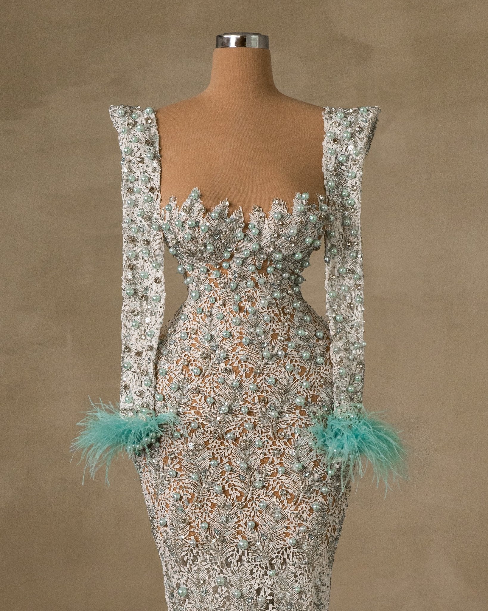 Elegant Blue Evening Gown with Feather and Bead Embellishments