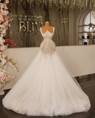 Elegant Sleeveless Bridal Gown Featuring Shimmering Crystals