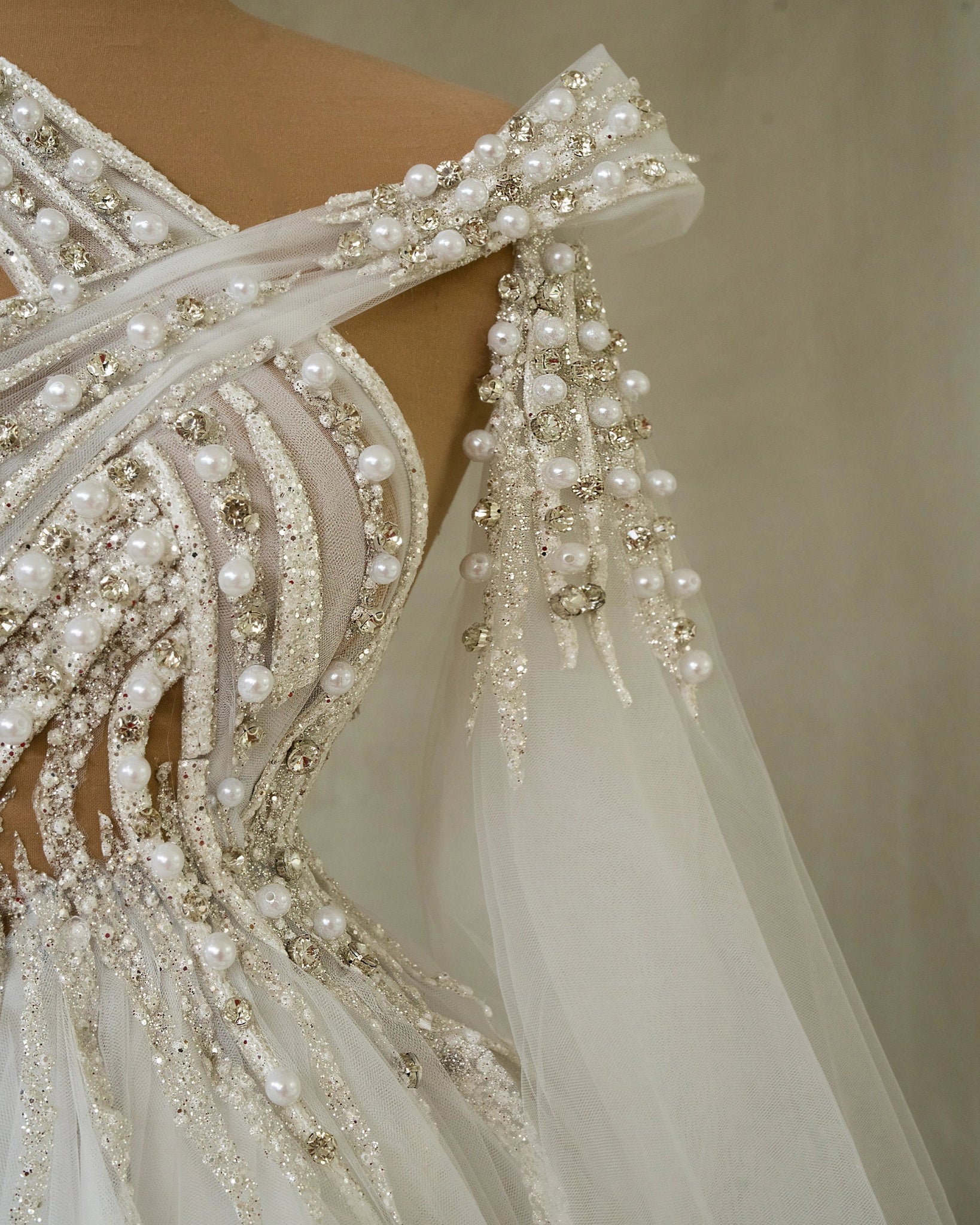 Modern Bridal Ensemble with Side Cape and Shimmering Crystals